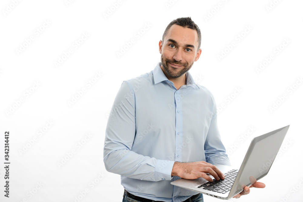 portrait of handsome casual business man worker wearing blue shirt working on laptop and cellphone studio shot isolated on white background portrait of handsome casual business man worker wearing blue shirt working on laptop and cellphone studio shot isolated on white background