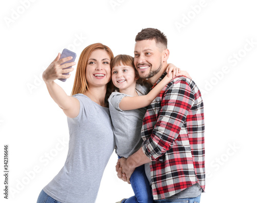 Family taking selfie on whi...