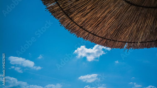 Beach umbrella with a blue sky in the background
