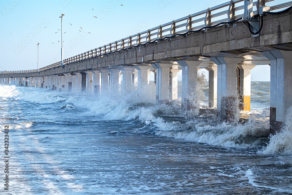 waves bumping against the lower part of the bridge