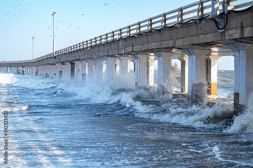 waves bumping against the lower part of the bridge