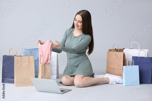 Young woman with laptop and...