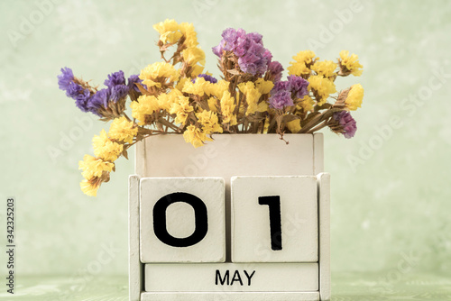 cube calendar for may on green with copy space