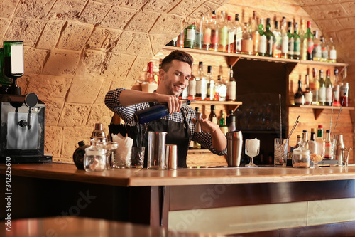 Bartender making cocktail i...