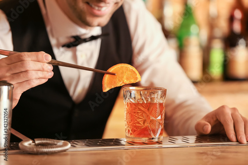 Male bartender making cockt...
