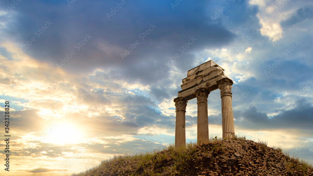 Rome, Italy - April 28, 2019 - View of the columns of roman ruins at sunrise in Rome