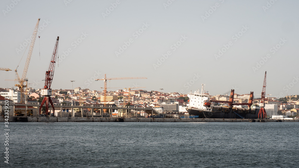 A cargo ship in dry dock at the Port of Lisbon, Portugal.