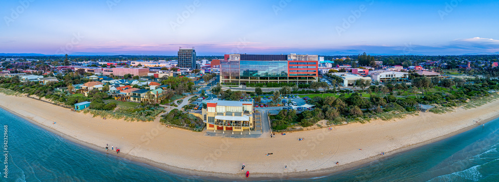 Wide aerial panorama of Frankston foreshore with the Waves restaurant and South East Water head office building at dusk. Melbourne, Victoria, Australia