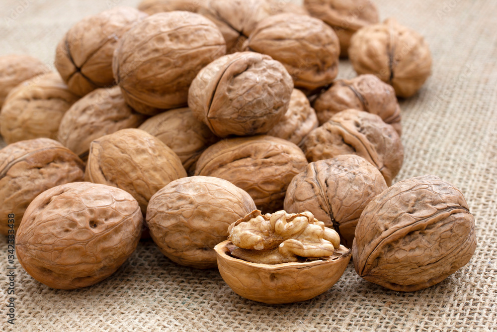 Fresh and organic walnuts on burlap Fresh and organic walnuts on burlap