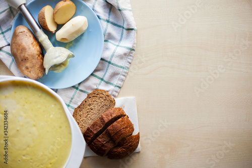  mashed potato soup with bread on table