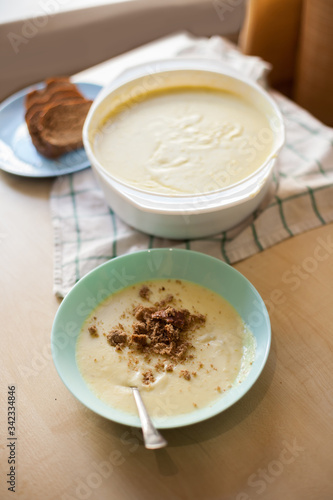 plate of mashed potato soup with bread