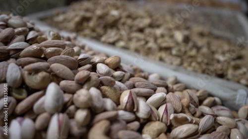 Pistachio and Walnut Shop. Cinematic Close Up of Nuts, Depth of Field Shot photo