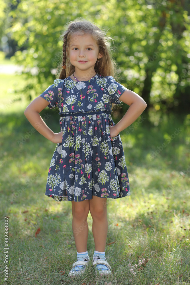Kid girl resting in summer field Kid girl resting in summer field