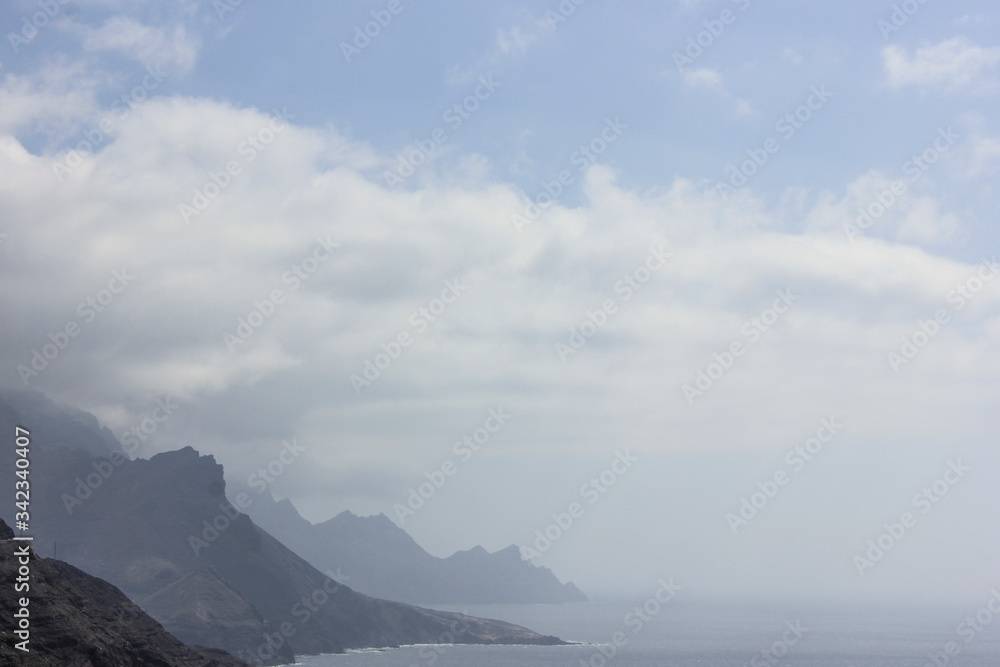 landscape of various cliffs and the sea on a foggy day, the sea looks grayish