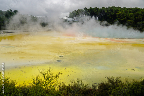 WAI-O-TAPU, NEW ZEALAND - MARCH 03, 2020: Steam clouds rising above the Champagne pool © emil