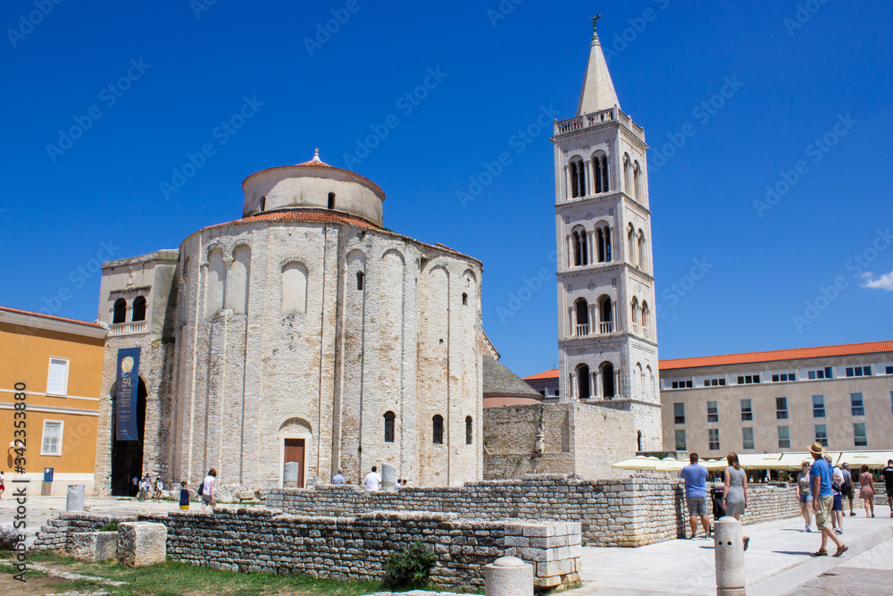 Roman Forum of Zadar, Croatia, with the Bell Tower of the Cathedral of St. Anastasia and the Church of St. Donatus at the background