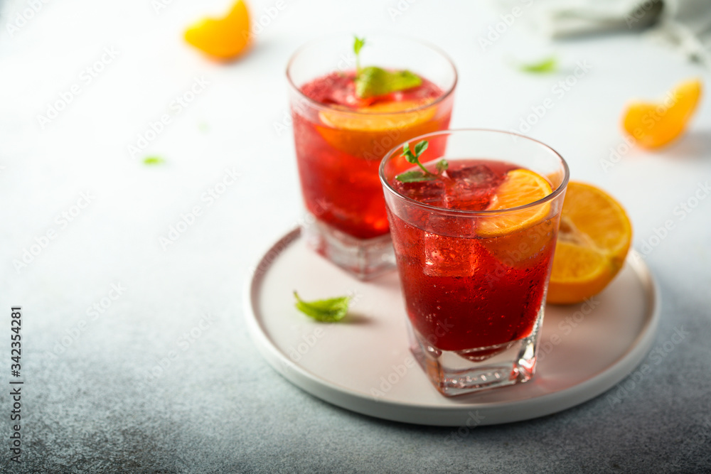 Homemade Negroni cocktail with fresh orange Homemade Negroni cocktail with fresh orange