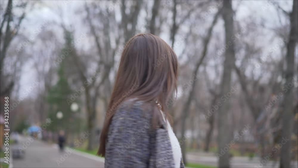 The girl went outside during self-isolation. Violation of the regime of self-isolation. The girl in the autumn park dances and enjoys life. The girl went outside during self-isolation. Violation of the regime of self-isolation. The girl in the autumn park dances and enjoys life.