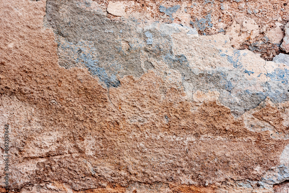 Texture of a concrete wall with cracks and scratches which can be used as a background