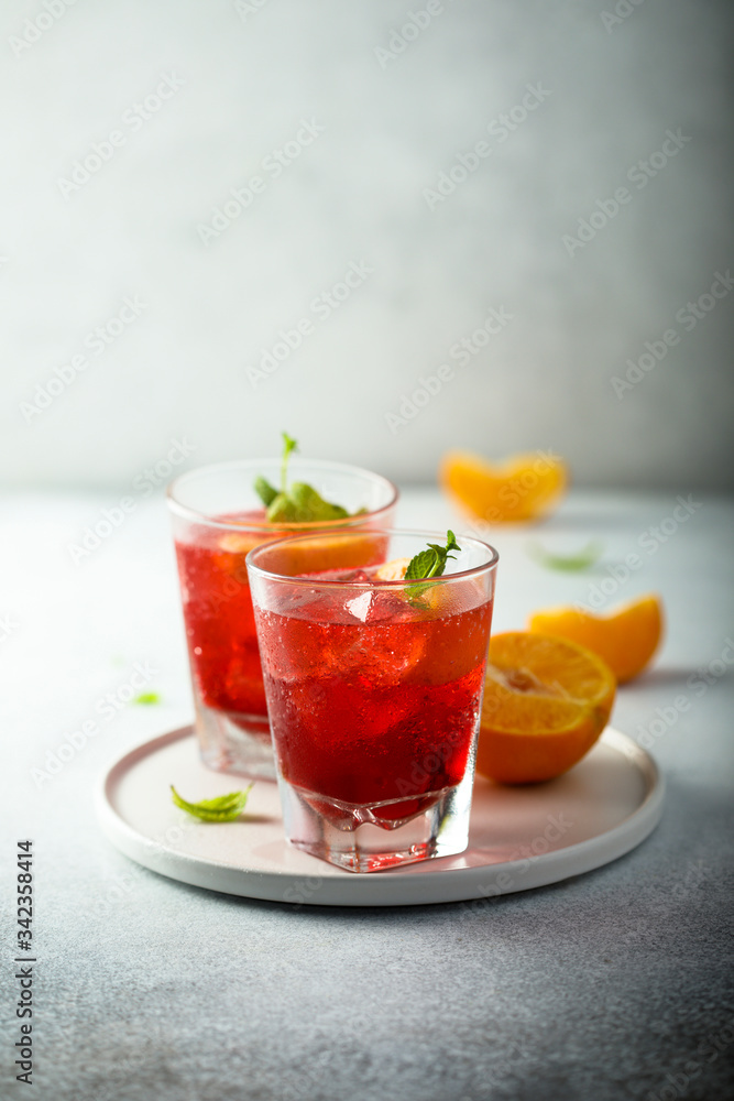 Homemade Negroni cocktail with fresh orange Homemade Negroni cocktail with fresh orange