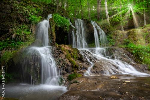 Waterfall in the forest. Beautiful waterfall Dokuzak in Strandzha Mountain, Bulgaria at spring. Green forest landscape near Bourgas