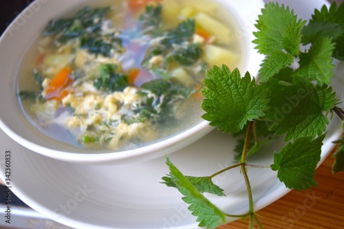 Healthy soup made with organic nettle, potato, carrots and egg.