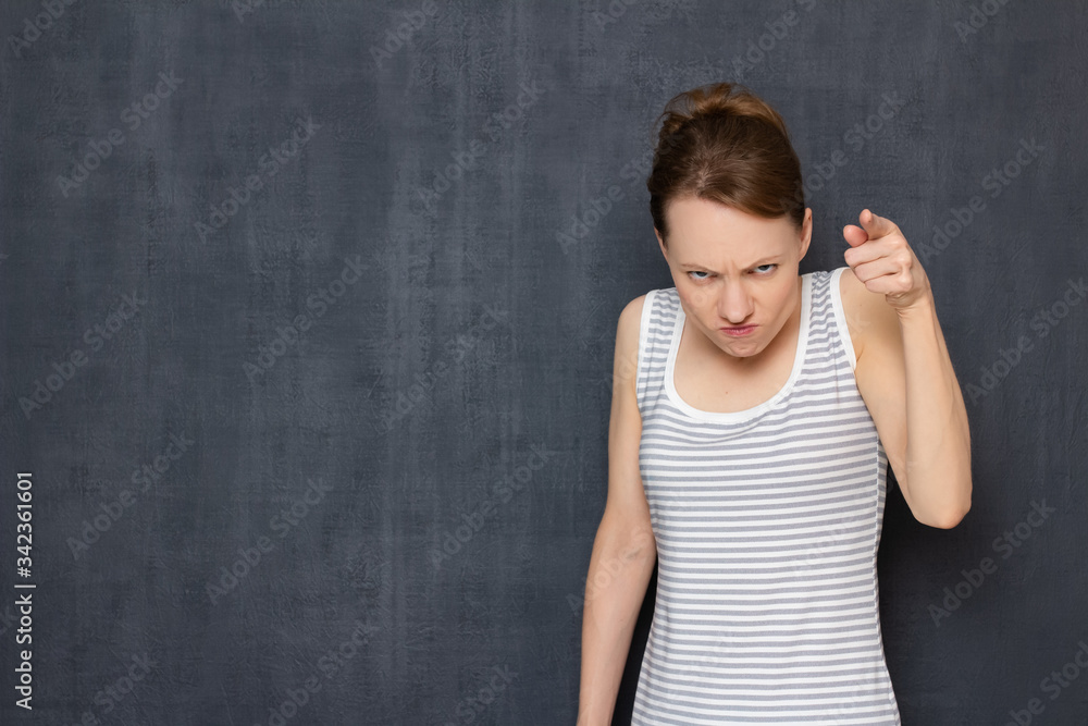 Portrait of angry annoyed young woman scolding and rebuking Portrait of angry annoyed young woman scolding and rebuking