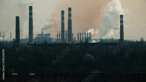 Epic pollution of nature copy space. Ecology damage pattern. Smoke, gas, steam background. Metallurgical industrial factory. Freight train. Industrial landscape. photo