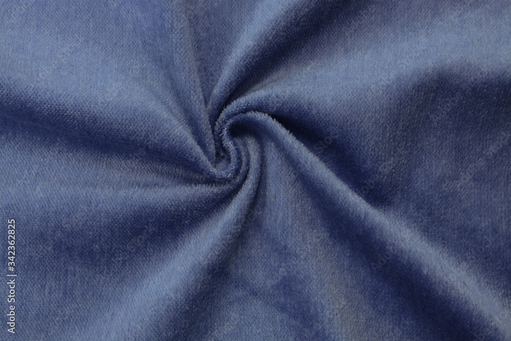 Fototapeta premium Corduroy blue background in close up. Texture of soft corduroy textile - useful as background