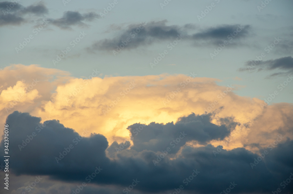 The evening sky with white clouds blurred with the patterned blur background