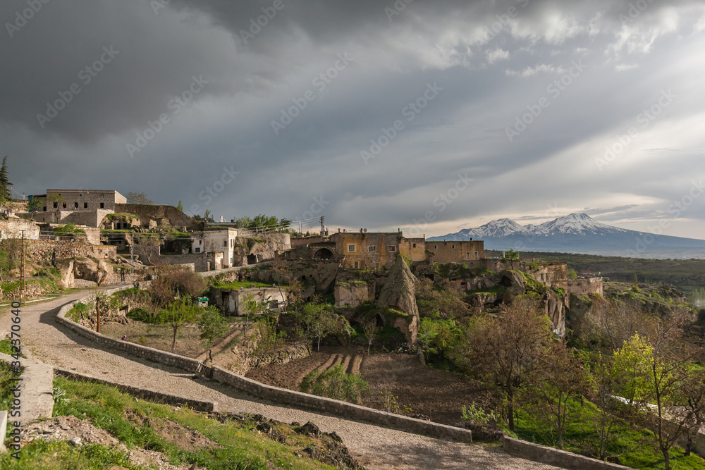 Guzelyurt city spring landscape dramatic cloudy sky Cappadocia 