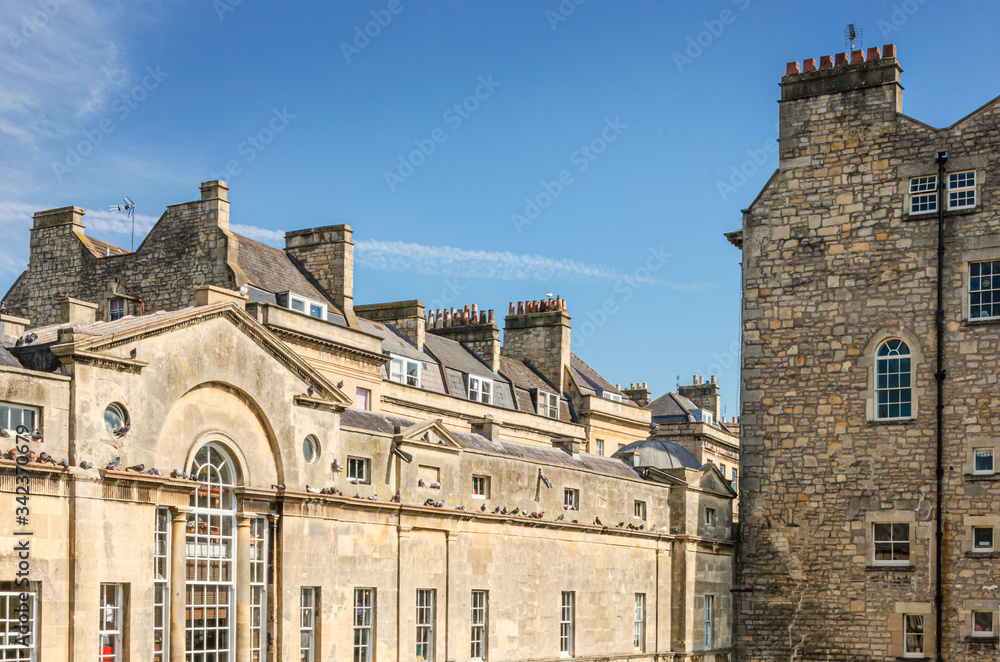 Detail of Pulteney Bridge over the River Avon in the city of Bath, Somerset, UK on a clear and sunny Spring morning