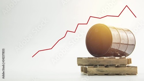 Clip of graph chart movement with oil barrel on pallet as background.