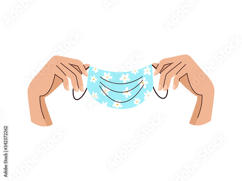 Medical respiratory mask to prevent desease coronavirus hold in female hands. Daisies chamomile trendy floral print. Hand drawn cartoon vector isolated illustration