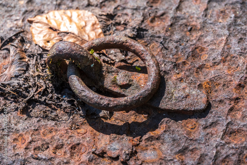 old rusty handle ring of an old iron door