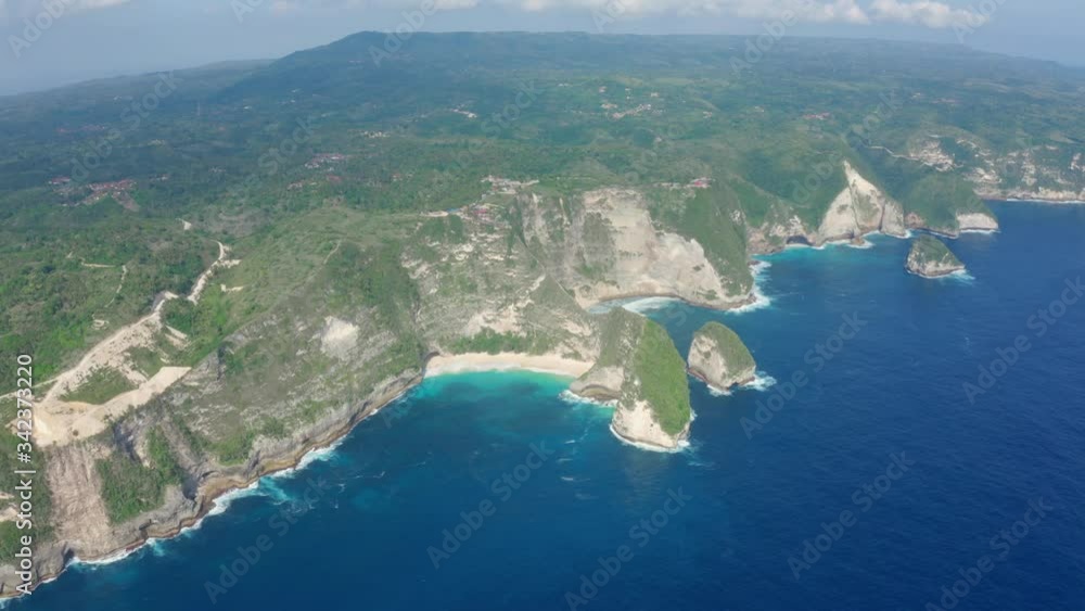 Aerial view at blue ocean and Nusa Penida island at sunny day, Bali, Indonesia Aerial view at blue ocean and Nusa Penida island at sunny day, Bali, Indonesia