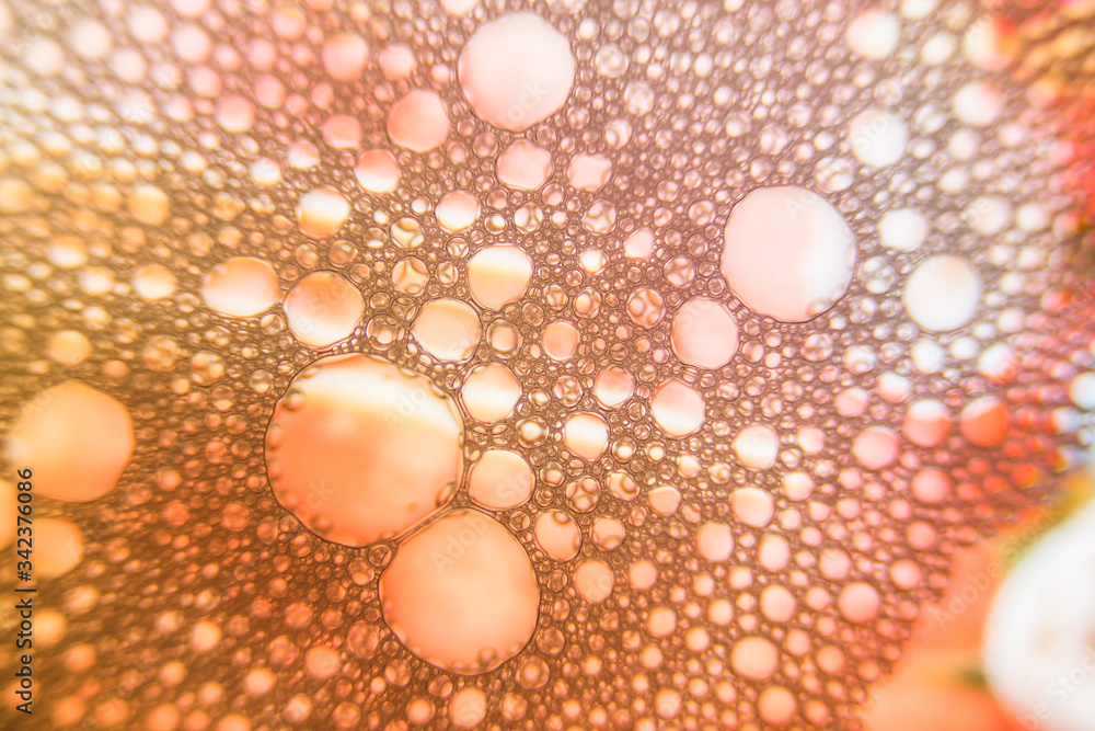 Drops of dew on the orange stained glass Drops of dew on the orange stained glass
