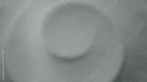 A 4K shot of sugar, sugar crystals rotating around. Over the top shot of ingredients for a dessert.