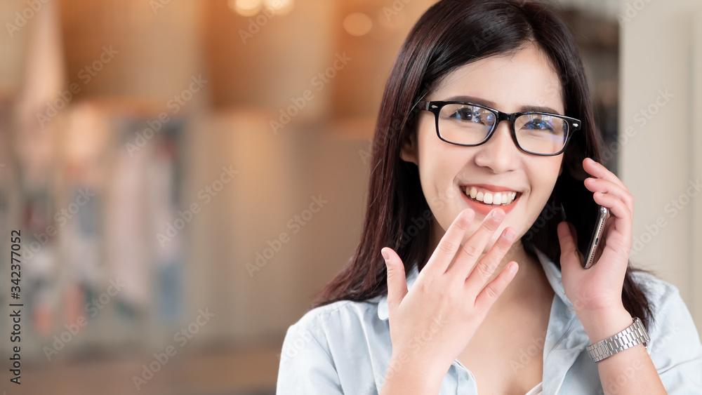 Close up Asian woman happy using smart phone in room home. Technology, Lifestyles and communication Close up Asian woman happy using smart phone in room home. Technology, Lifestyles and communication