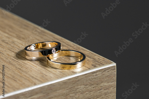 Close up Pink gold wedding rings on table with black backgroung