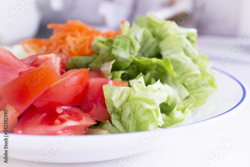 Lettuce, carrot, cucumber, tomato and onion salad