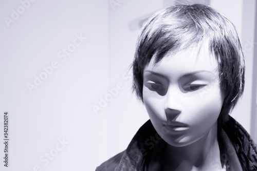 Young mannequin with short hair. Neutral expression