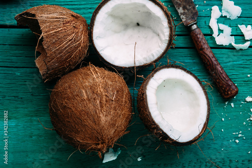 Coconuts on a bright wooden background close-up