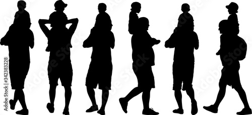 dad with his baby carrying him on his shoulders