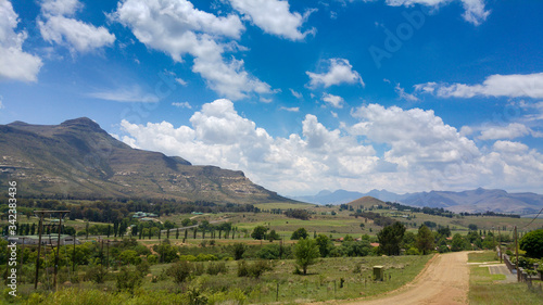 Fluffy clouds over rock formations in the Golden Gate Highlands National Park, Clarens, Free State, South Africa