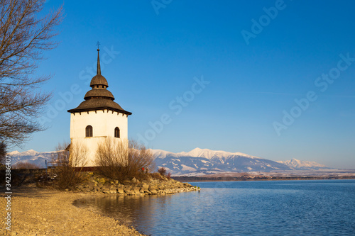Church of Virgin Mary in Havranok and lake Liptovska Mara, district Liptovsky Mikulas, Slovakia
