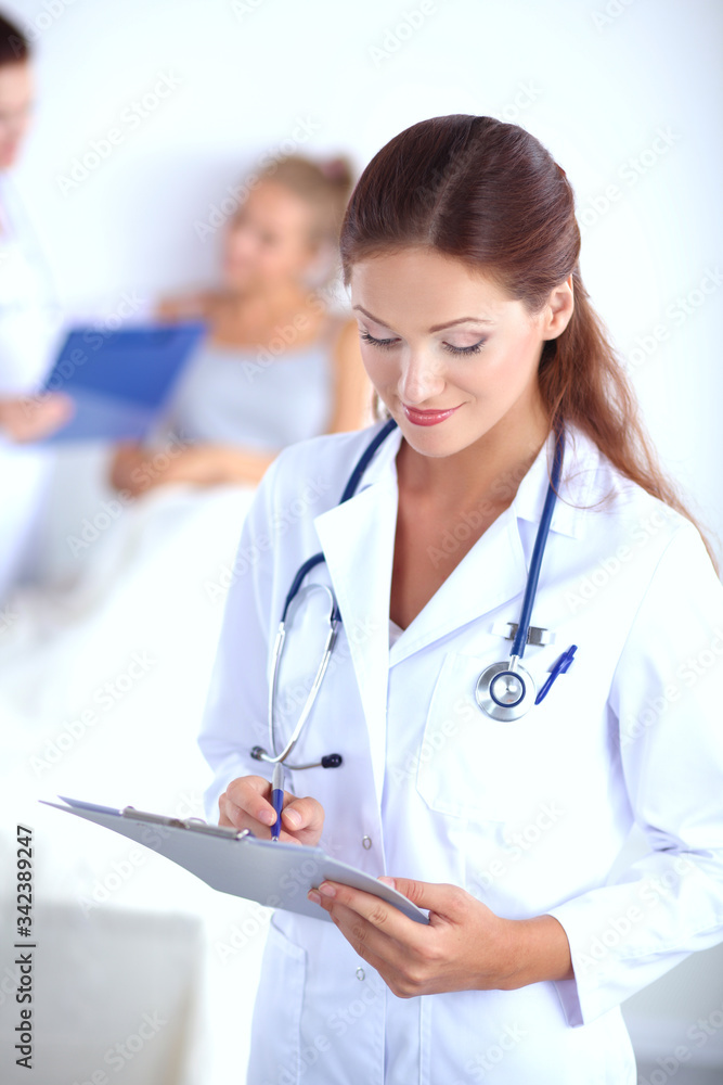 Woman doctor standing at hospital