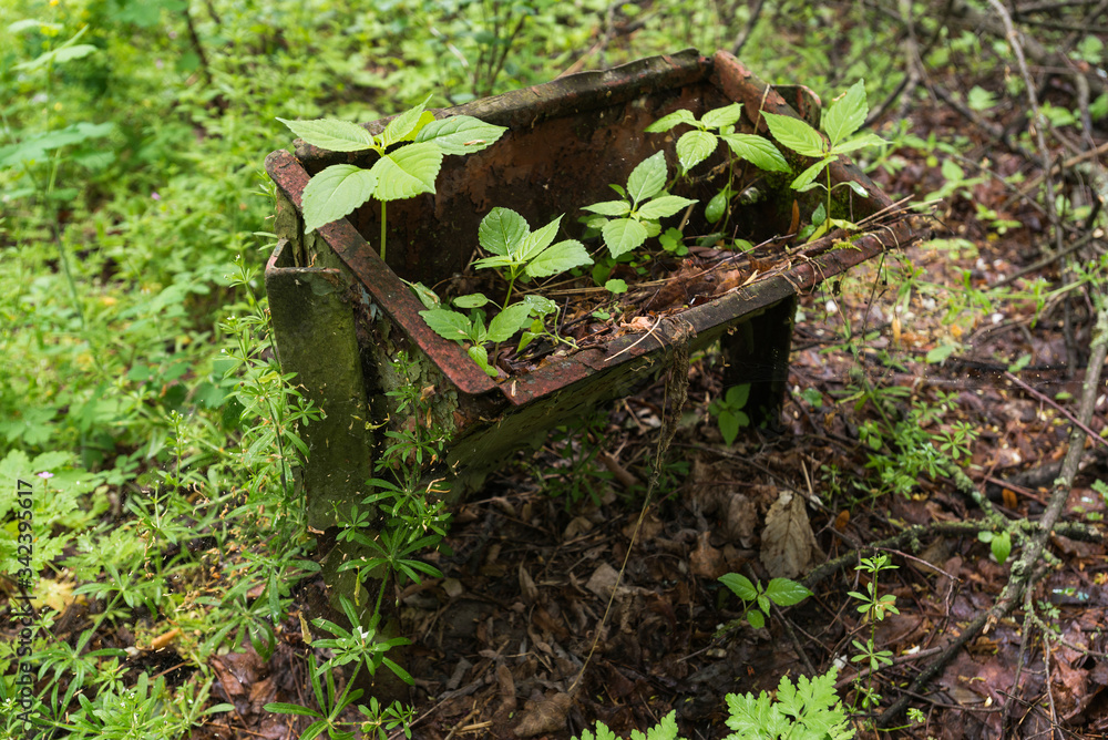 Old rubbish bin in abandoned ghost town Pripyat in Chernobyl zone Old rubbish bin in abandoned ghost town Pripyat in Chernobyl zone