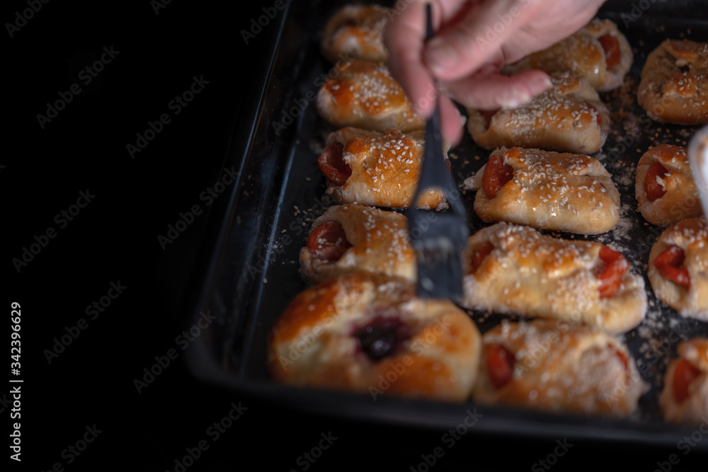 Sweet pastries on a baking sheet from the oven