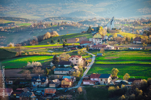 Church in spring rural landscape, colorful warm sunrise light. Religion, christianity photo, Slovakia, Europe